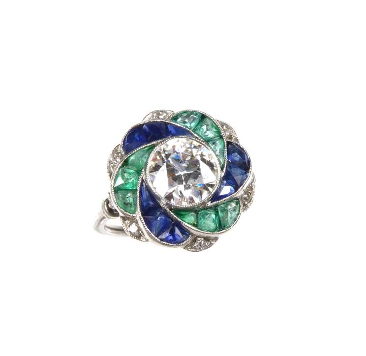 Single stone diamond, emerald and sapphire spiral scroll cluster ring